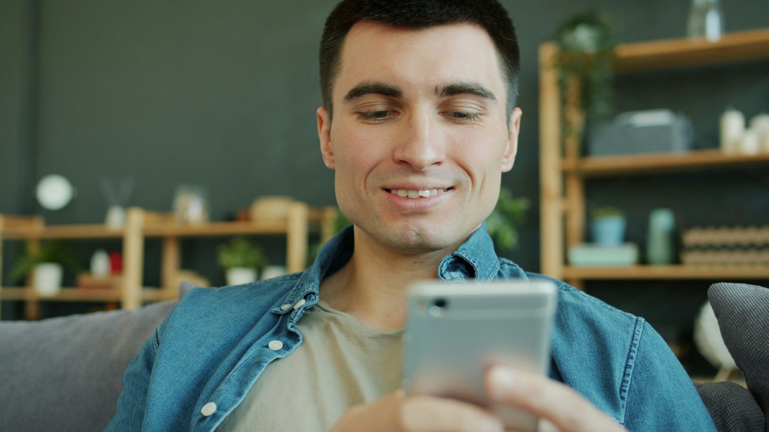 Patient text message conversation on smartphone for dental reactivation campaign